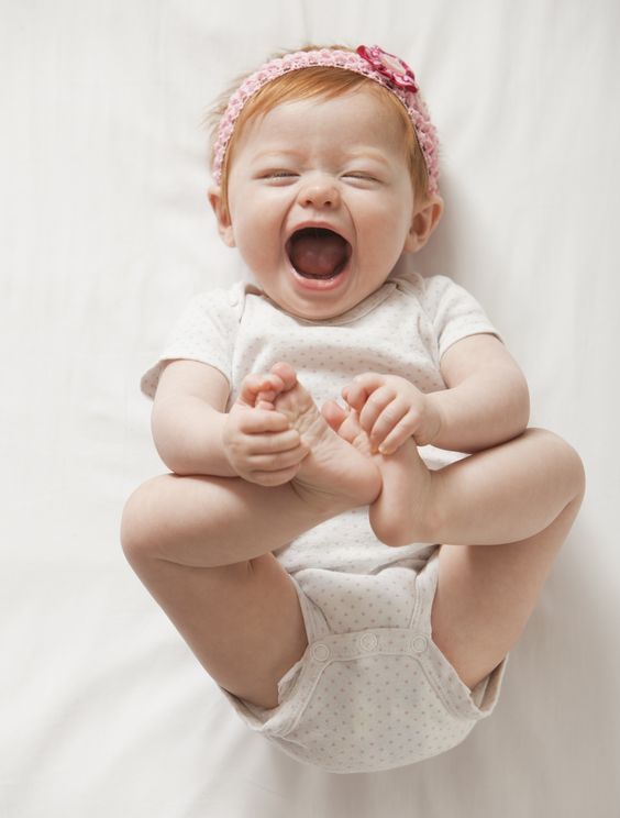 Laughing Caucasian baby girl